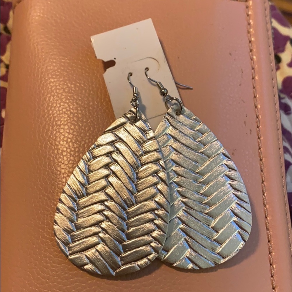 NWOT’s silver vegan leather earrings
